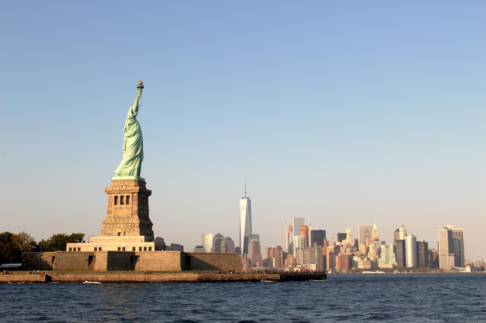 new york statue of liberty skyline at night