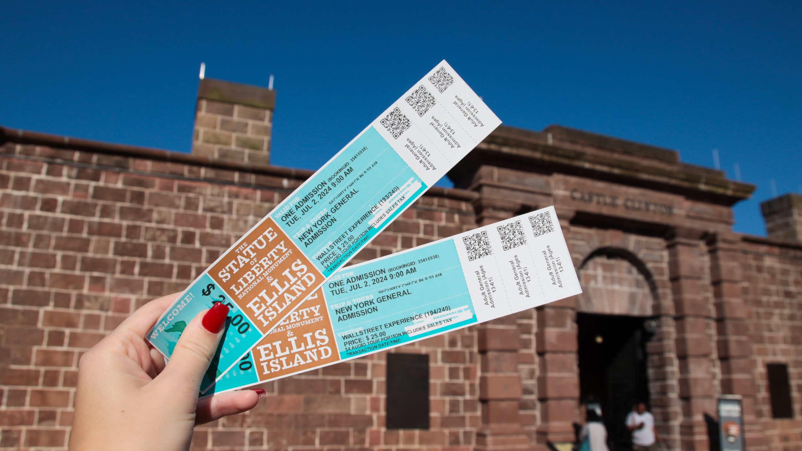 Statue of Liberty and Ellis Island admission tickets close up