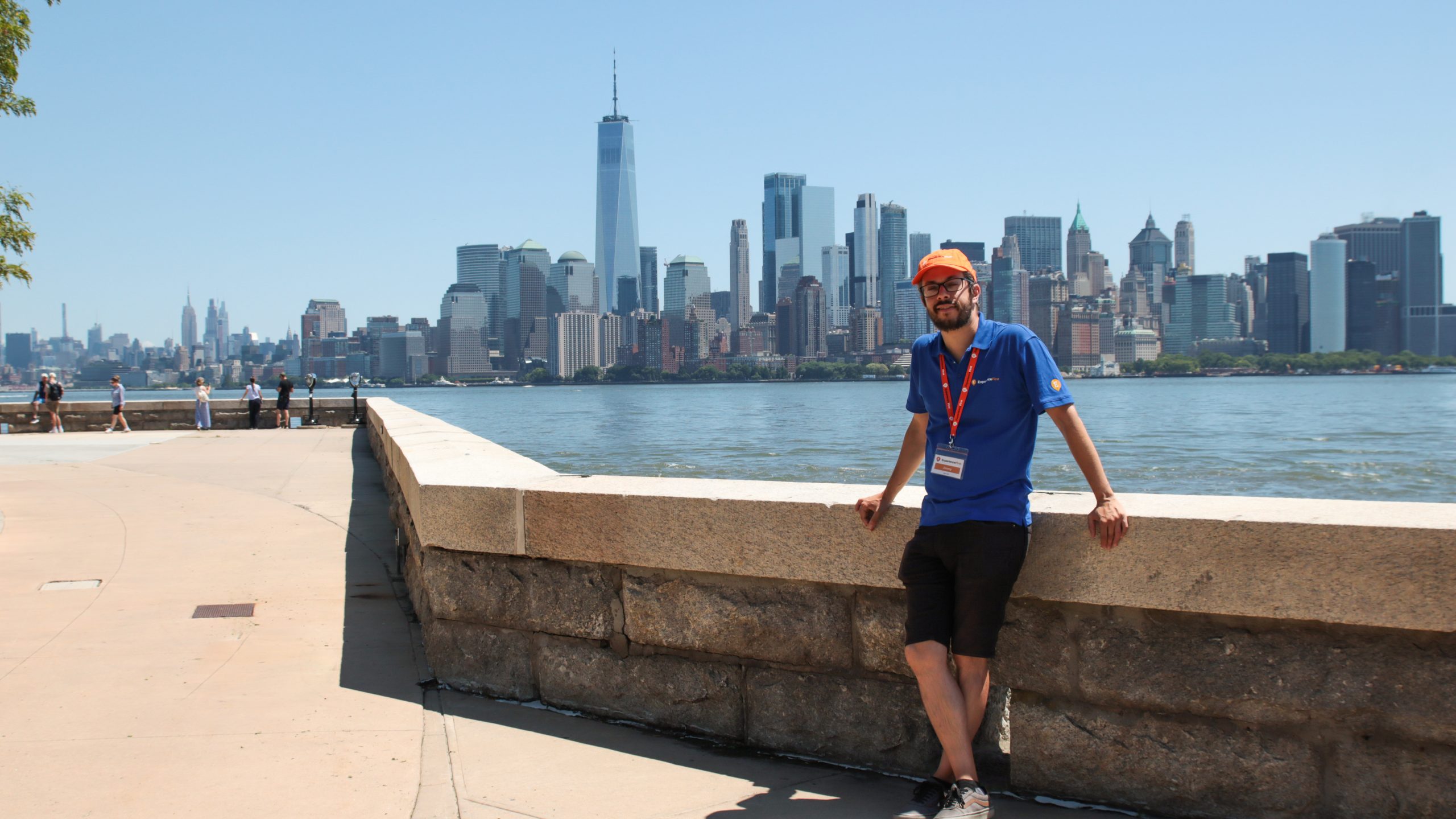 Tour Guide posing against New York Cityscape and Hudson river